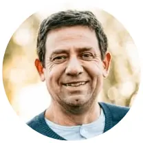 Man smiling confidently during his daily wellness routine